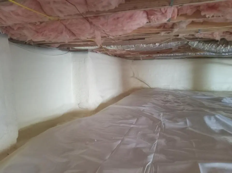 Crawl space encapsulation with closed-cell spray foam for Flat Roof Repair in Lowell